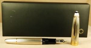 Silver fountain pen with black box background.