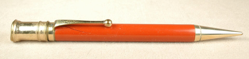 Red mechanical pencil with metal accents.