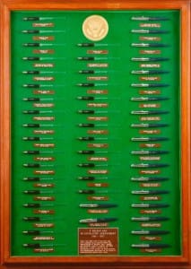 Display case of military submarine plaques.