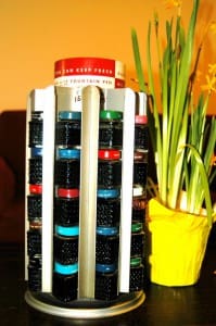Spice rack and yellow potted flowers.